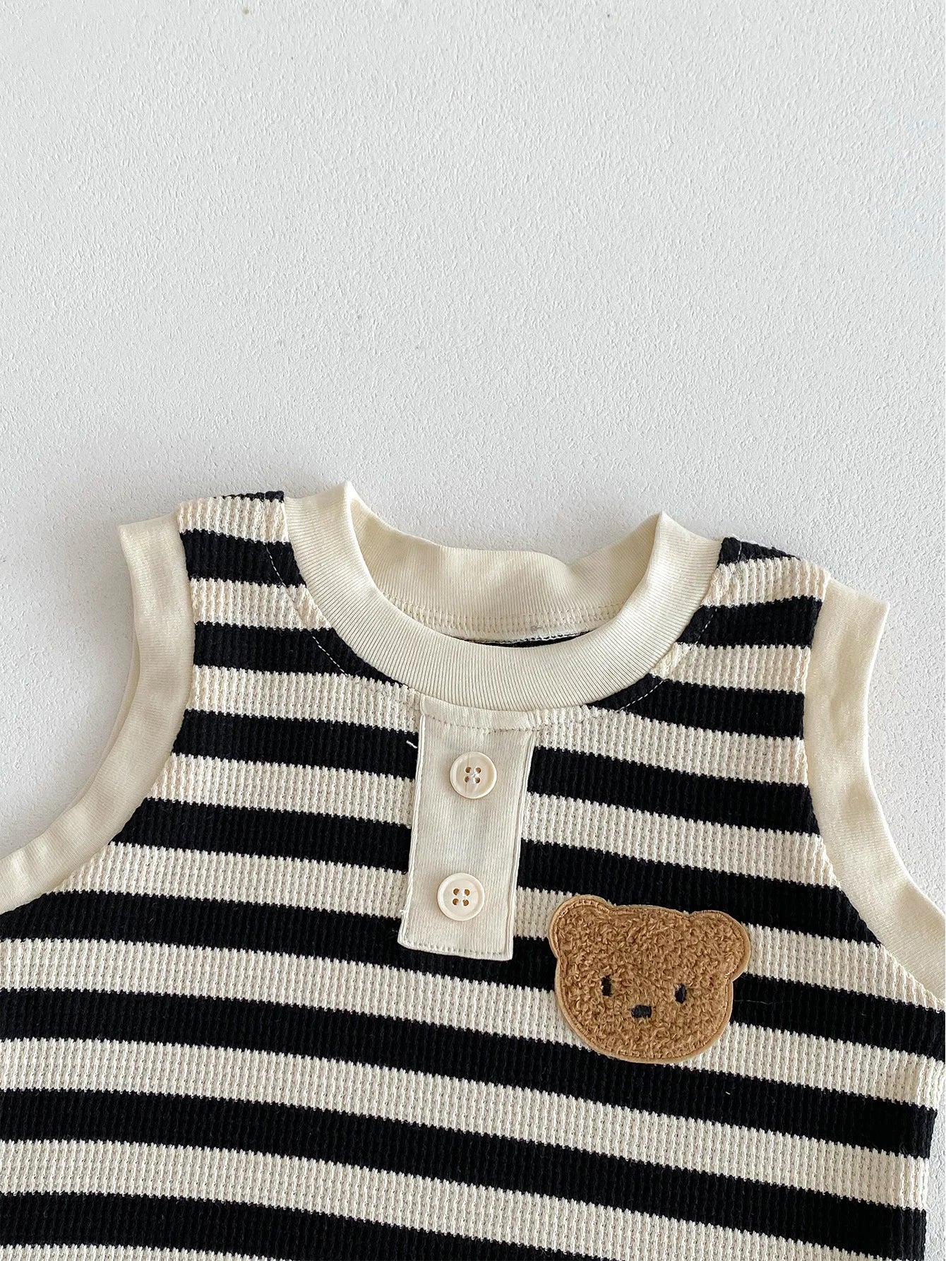 MILANCEL baby sleeveless tee with black and white stripes and bear patch for boys.