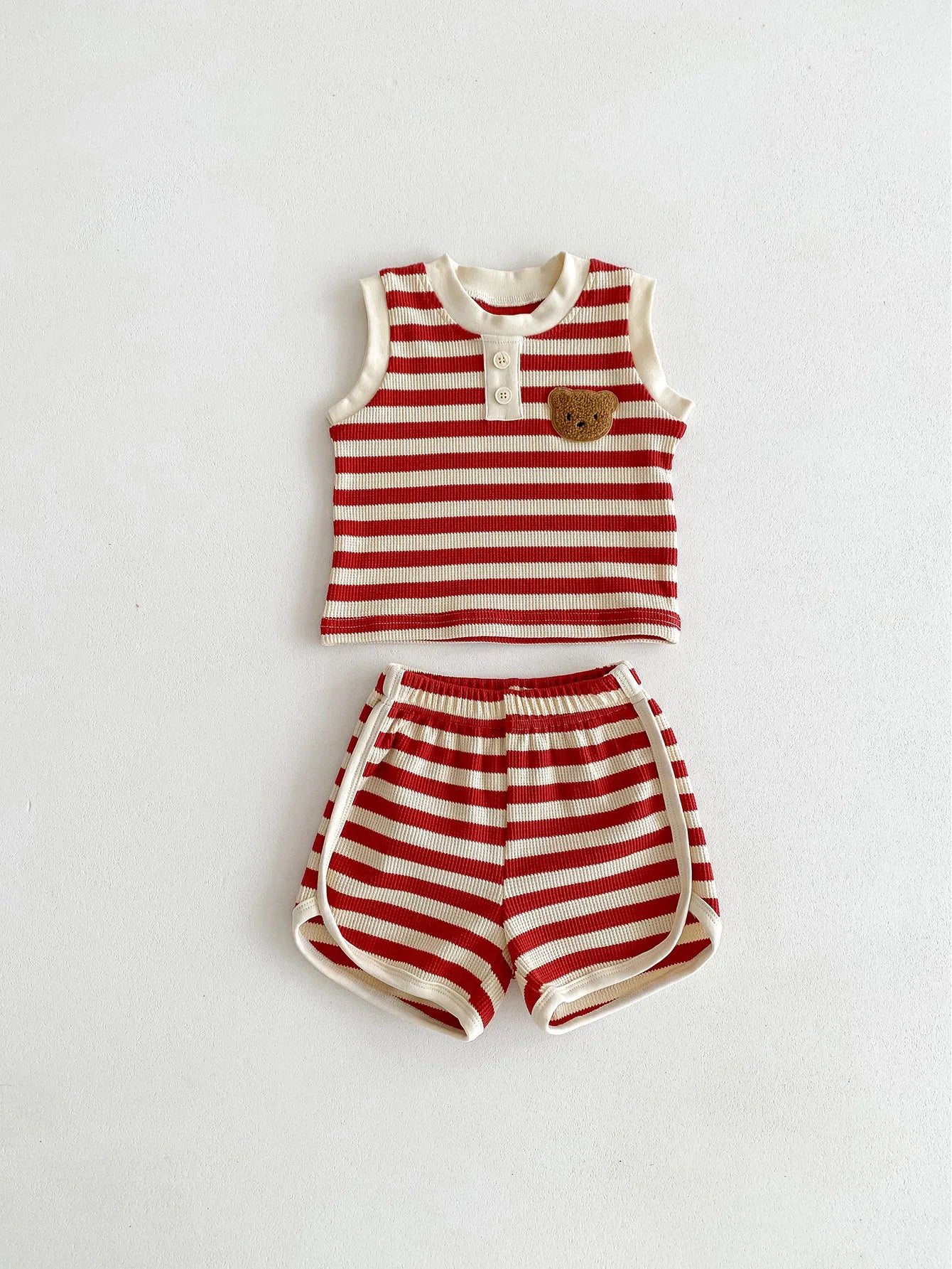 Red and white striped sleeveless tee and shorts set for babies by MILANCEL, featuring a cute bear patch.