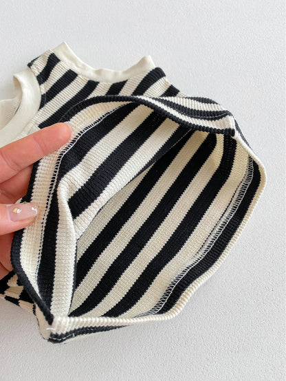 Close-up of the interior of a striped sleeveless tee with black and white patterns, showcasing its fabric texture.