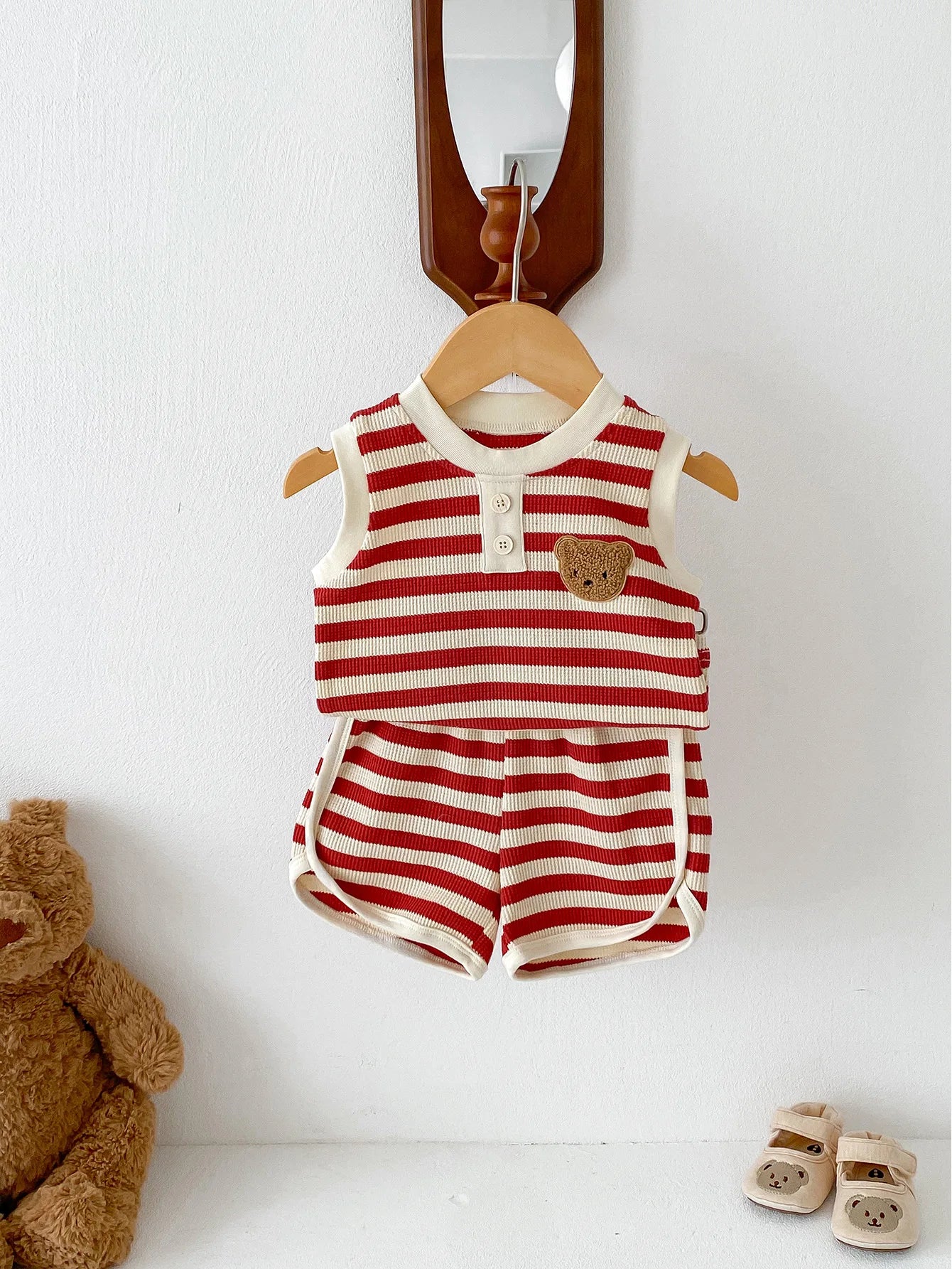 Baby sleeveless striped set featuring a teddy bear patch, ideal for children aged 0-36 months, styled with shorts.